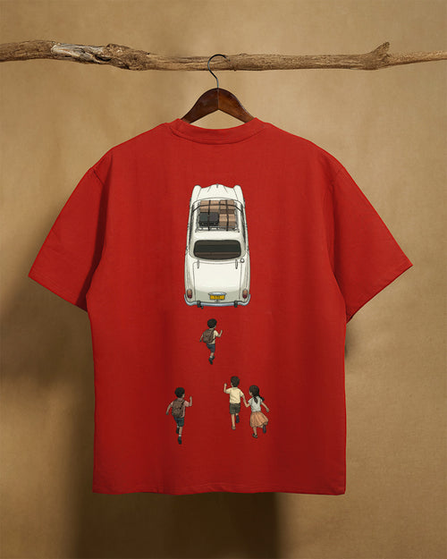 Back view of a brick red Printrove ambassador unisex oversized T-shirt made from 240GSM fabric, casual and comfortable fit.