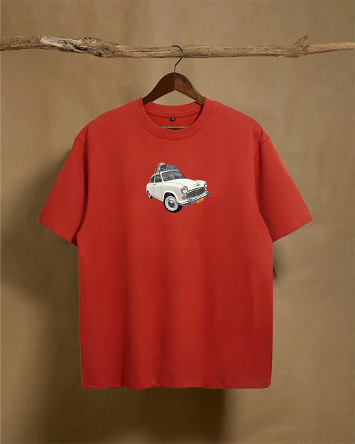 Front view of a brick red unisex oversized T-shirt by Printrove, made from 240GSM fabric, showcasing a relaxed fit and casual style.