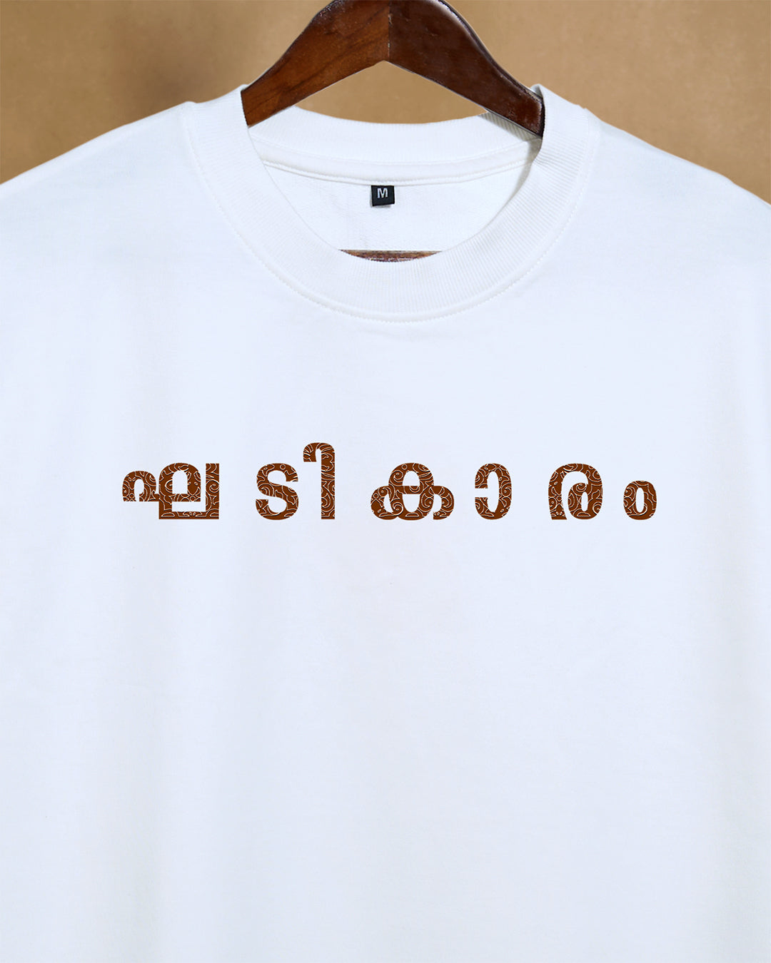 Close-up of white Gadikaram oversized unisex T-shirt by Printrove, showing front detail and soft 240GSM fabric.